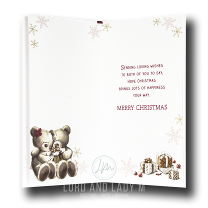 Christmas card with two teddy bears holding a heart, surrounded by snowflakes and gift illustrations, with a short verse message.