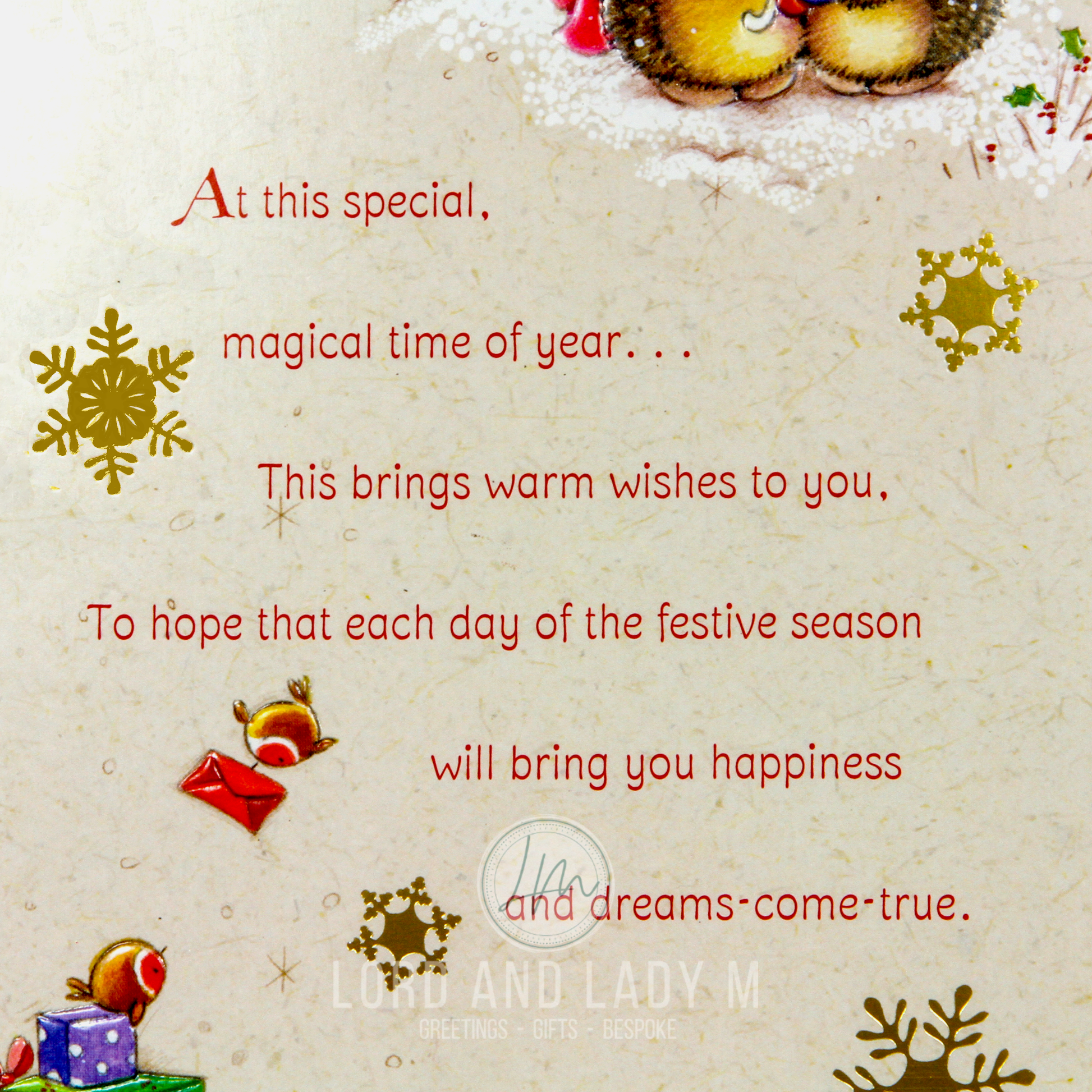 Christmas card front. Close up of the text and festive elements on a printed texture background