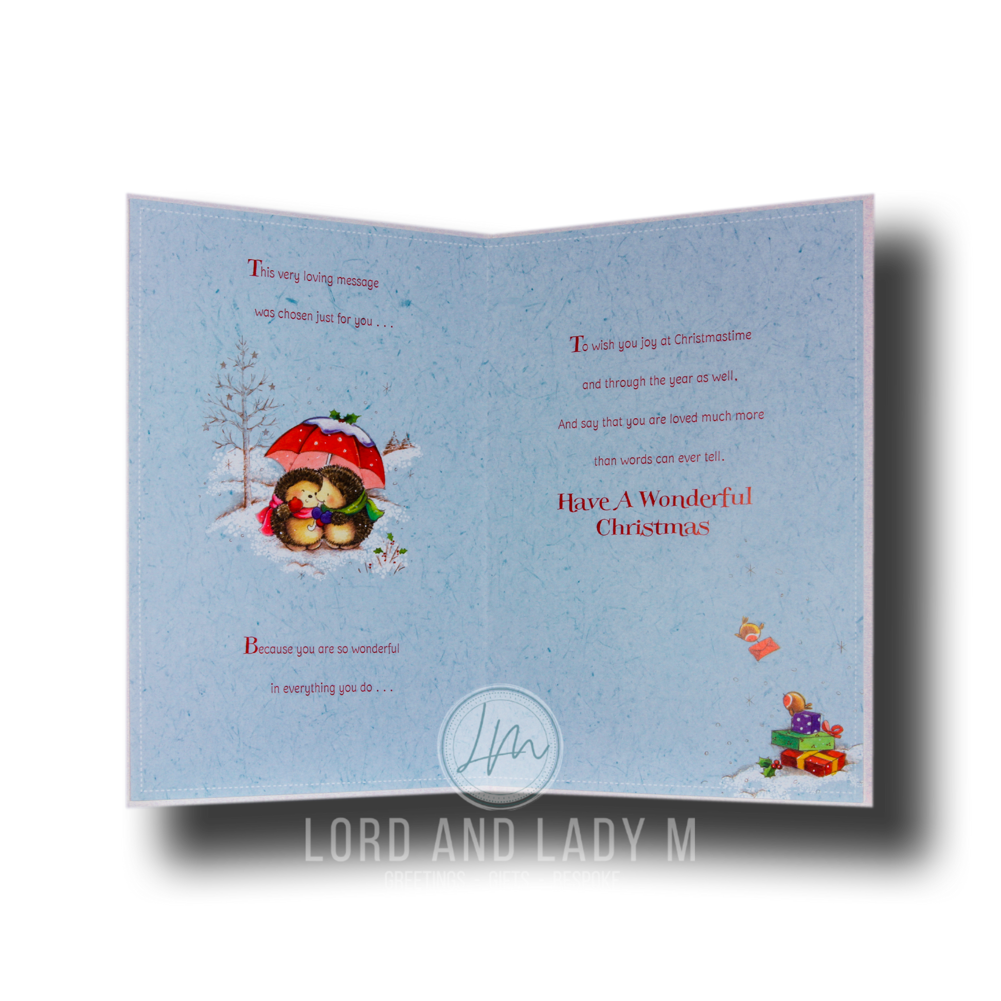 Full image of the open Christmas card with printed blue insert featuring a verse over 2 pages and hedgehogs.
